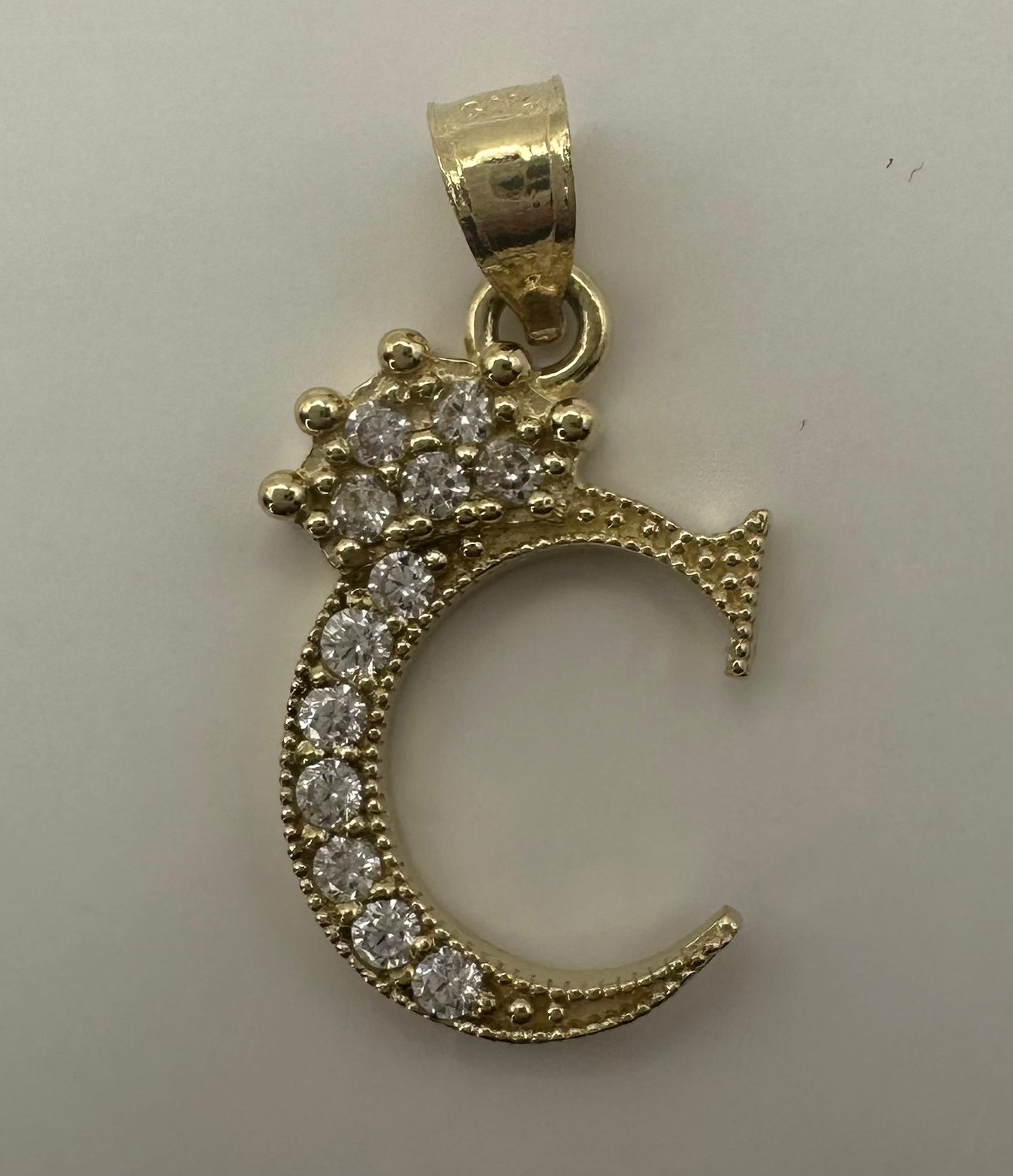 Small initial pendent letter "C"